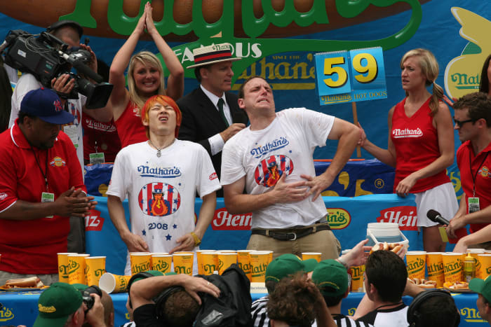 Kobayashi and Chestnut needed sudden death overtime to settle the 2008 Nathan's Famous Fourth of July hot dog eating contest. Chestnut prevailed, eating a total of 59 dogs.